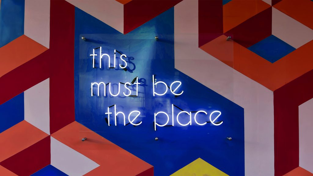 A sign with the words this must be the place